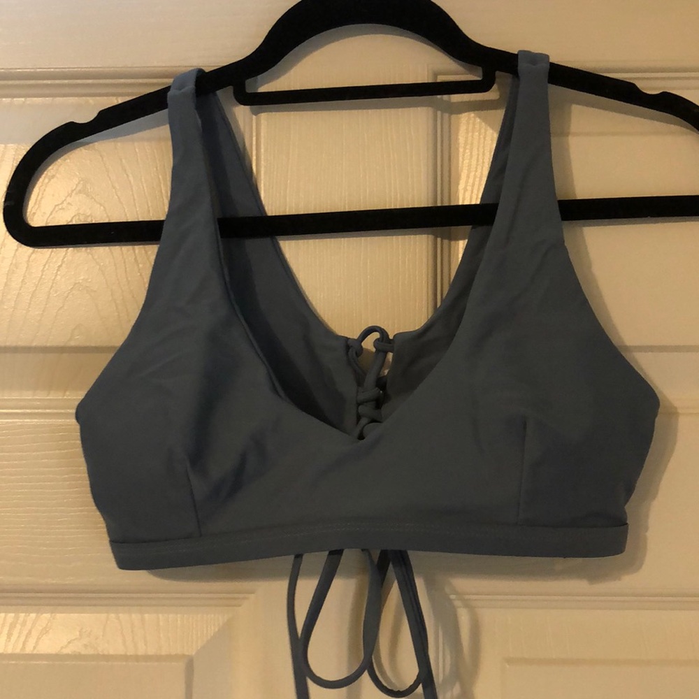 Deep V blue swim suit top that laces up the back